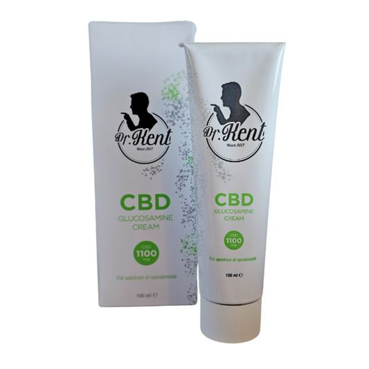 Et billed af en tube Dr. Kent creme med indpakning ved siden af.