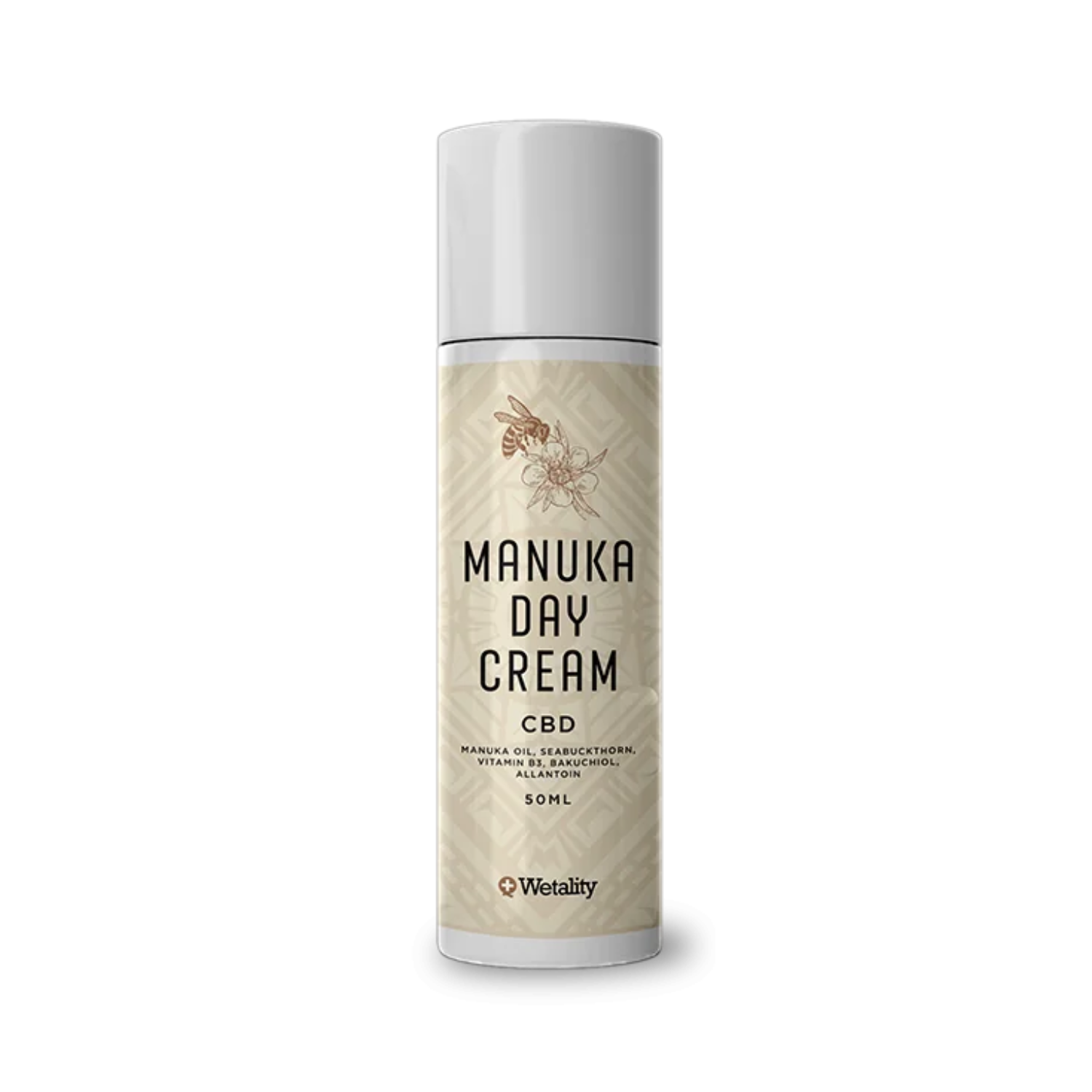 En hvid tube med en lys brunt label, med teksten "Manuka day cream - CBD". Over teksten er en tegning af en bi der sidder på en blomst.